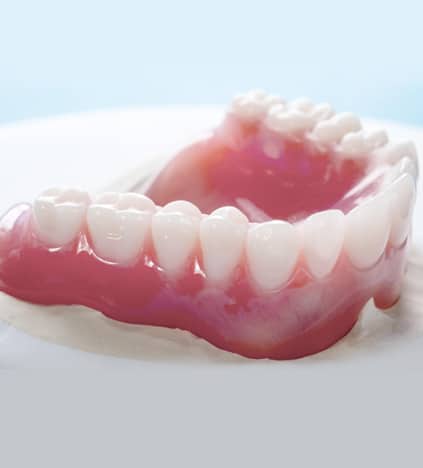 Dental model showing upper and lower teeth arrangement for orthodontic or prosthodontic planning.